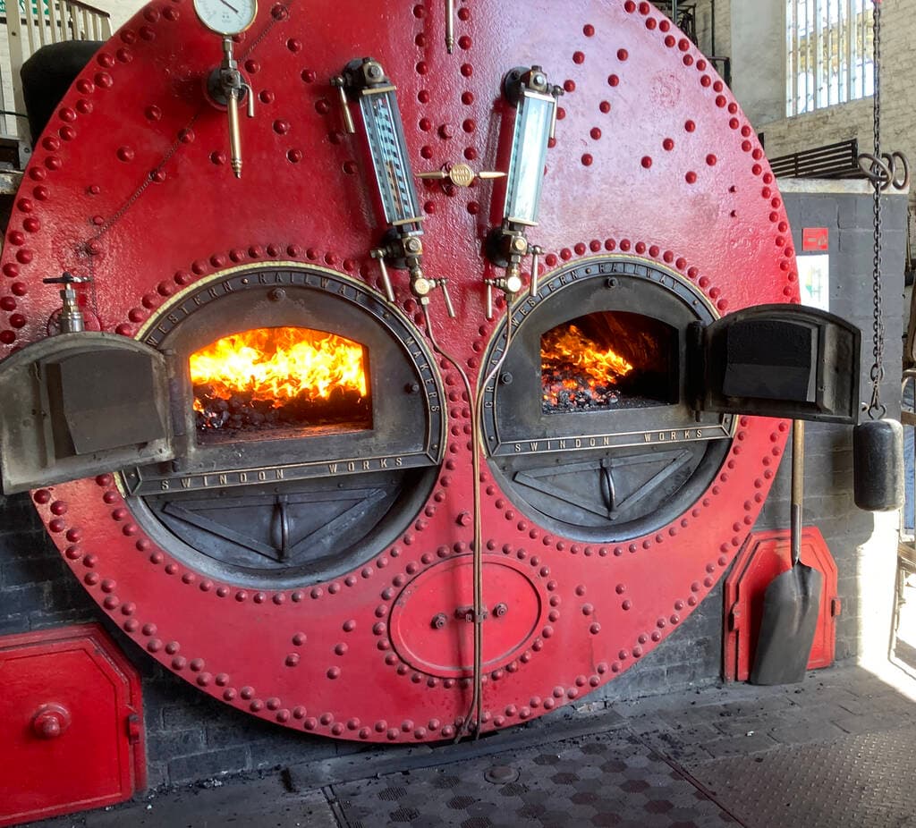 Crofton's boiler raising steam to drive the engines.
